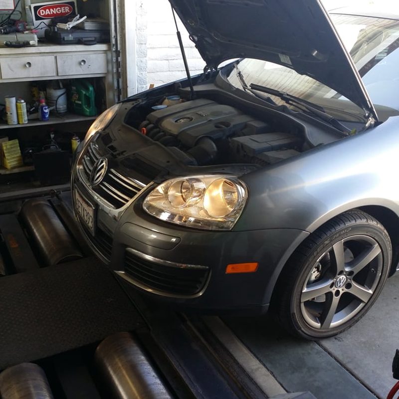 Car on the dynamometer during a smog test at Super Smog